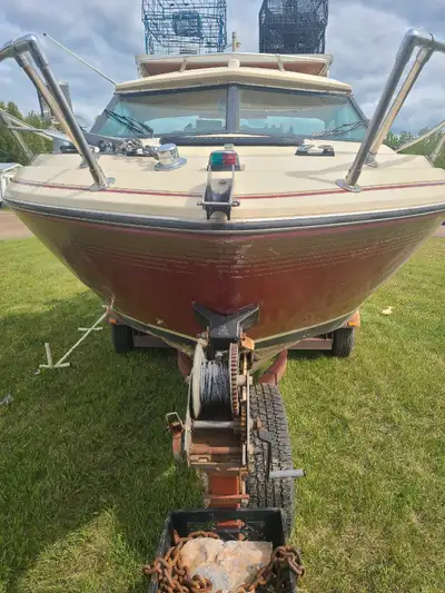 A Fiberform 22' Fiberglass boat and 1981 trailer with a Mercury 270hp inboard gas engine. Comes with...
