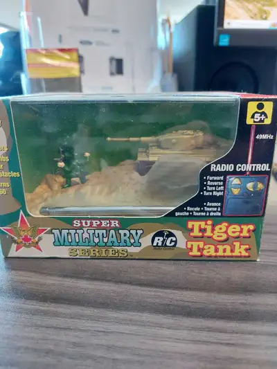 Mini RC Tiger Tank. Works fine. Just making some space on my desk. Also have a 1/18 Henglong Panzer...