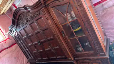 one of a kind carved wood cabinet with striking architectural detail and storage features doors and...
