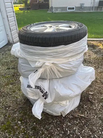 All weather tires in like new condition. Only 3500 kms on them! Comes with factory rims and tire pre...