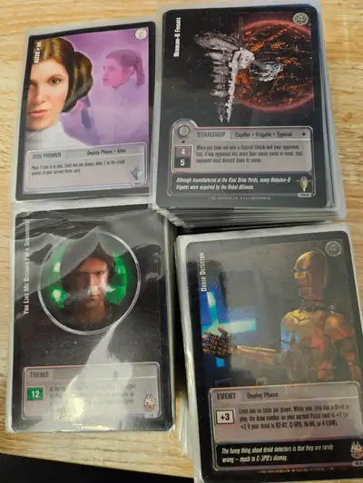 Collection of Jedi Knights TCG card from Decipher. Includes several hundred regular cards, 6 gold st...