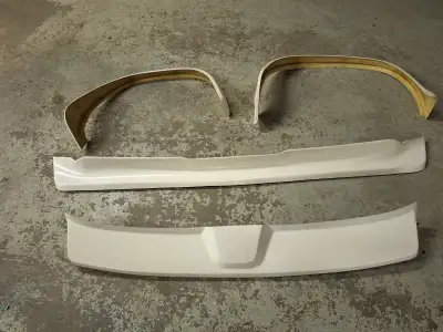 Selling a fiberglass body kit for 70's ford vans. It includes under bumper spoiler, fender flares x4...