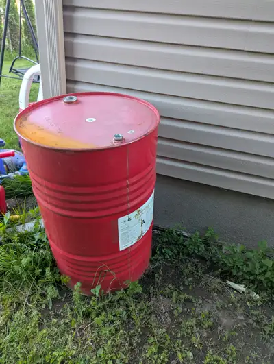 This is a 55-gallon industrial steel drum (also known as a 200-liter metal barrel) with a closed-top...