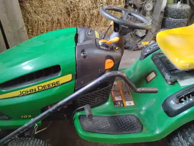 John Deere 102 model with plow chains and 42 in mower. Excellent condition. Low hours. Can deliver u...