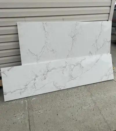 Selling 2 leftover Calacatta Venezia quartz slabs/remnants in excellent condition. Beautiful white s...