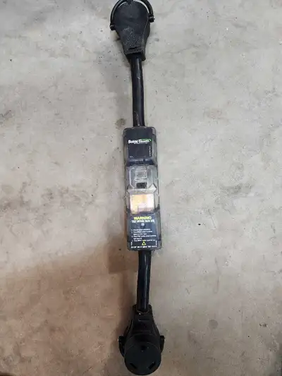 I am selling this collection of pre-owned RV supplies, which includes a Surge Guard electrical prote...