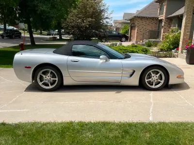 2 door convertible corvette silver w. Black leather interior; 88,000 km one owner; has been safetied...