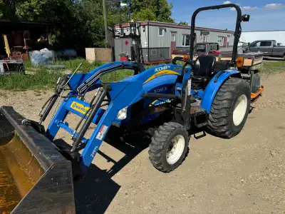 2012 New Holland 30 hp Boomer tractor. Comes with front loader with bobcat style quick attach and re...