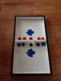 Slingshot tabletop hockey game 