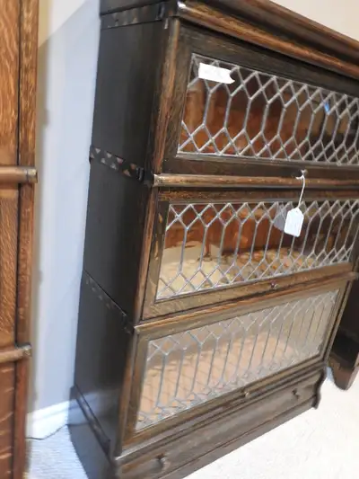 This high end barrister bookcase made by Macey beetween 1895 and 1910, has a drawer in the base and...
