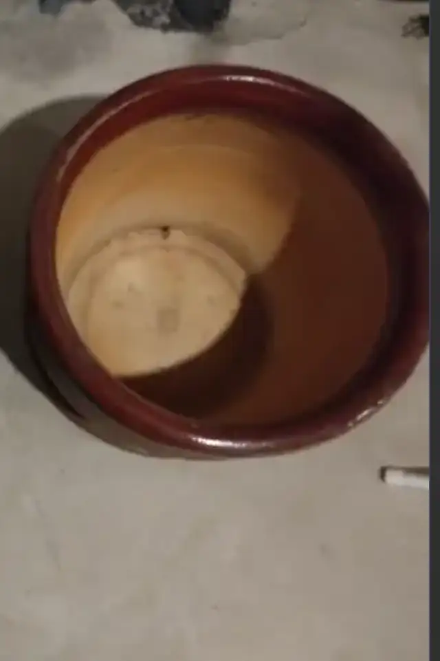A Large ceramic pot with a drain hole and saucer.63882168734979122