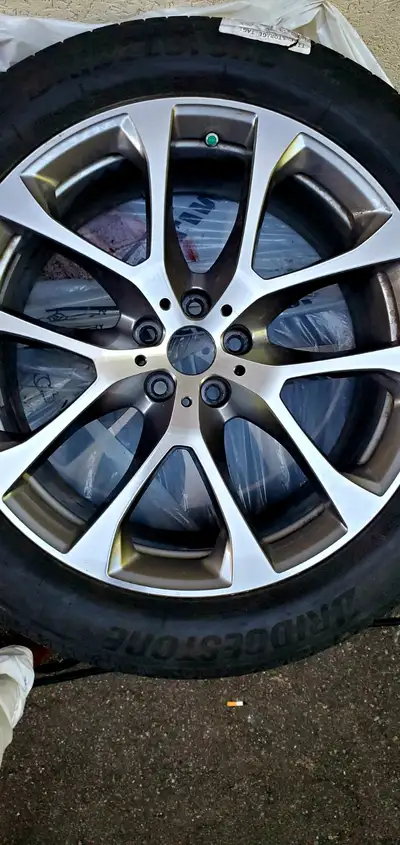 4 Rims and All Season Tires 20 Inch in excellent condition taken off 2020 BMW X5 central caps are mi...