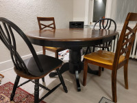 solid wood round extendable dining table and 4 chairs