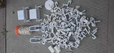 White plastic and metal Rubbermaid wire shelving hardware lot. This collection includes wall clips,...