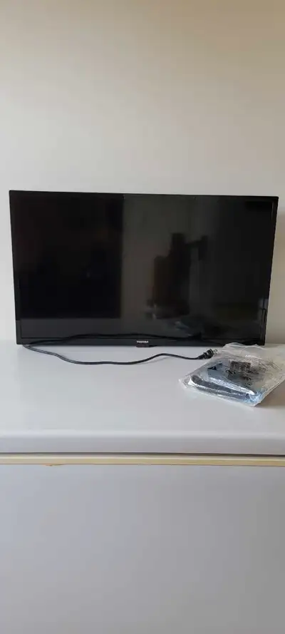 Have a brand new 32 inch toshiba tv. This TV was hung on the wall as a staging for a house sale. Was...