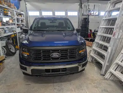Brand new factory takeoff front bumper from a 2026 F150 including fog lights, tow hooks and rubber v...
