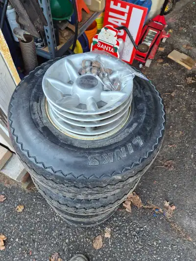 Club car golf cart wheels and tires with hub caps and luggage nuts. don't leak air only selling beca...