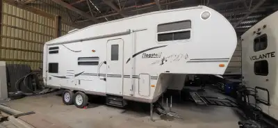 Aluminum frame , 2 new tires, gas/electric hot water tank, come with a BBQ with gas attachment on th...