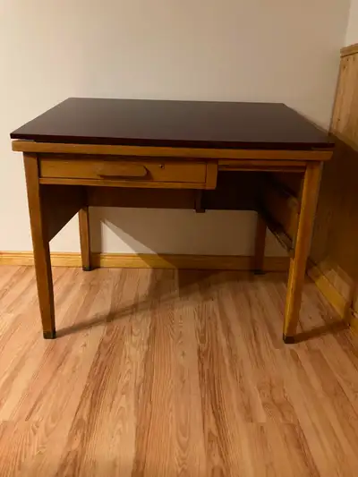 Very sturdy solid wood with added adjustable angle top. 42 inch wide 30 deep 32 high