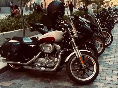 This 2012 Harley Davidson Sportster 883 XL is a classic cruiser in mint condition, perfect for rider...