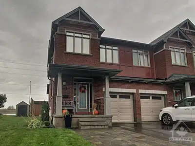 Gorgeous end unit townhome in a prime location on a large corner lot. Two-minute walk to the shoppin...