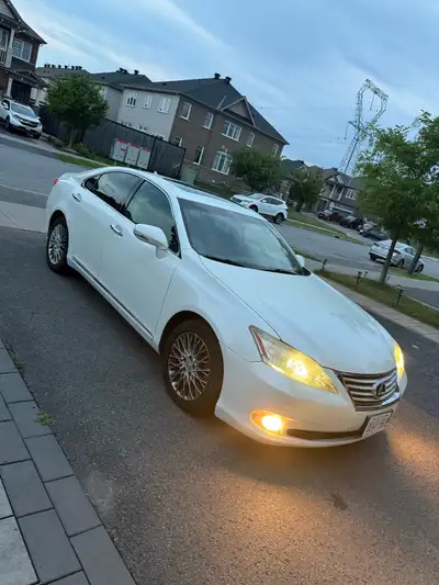 Reliable 2011 Lexus ES350 Pearl white exterior with black leather interior. Originally owned by a Le...