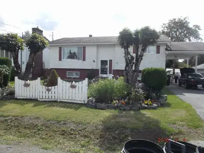 Compact energy efficient home with two bedrooms on main floor with 2 more in rental units in basemen...