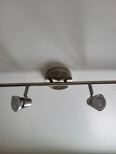 Have a number of brand new two head track lights for sale. Wall or ceiling mount with adjustable swi...