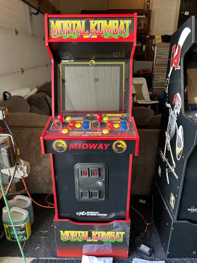 Used only a few times and the kids/husband lost interest. Mortal Kombat arcade game with riser . Als...