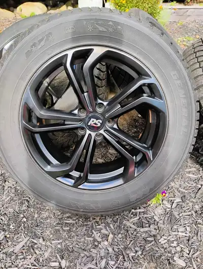 18" rims with winter tires. Tire size 245/60R18. Came off VW Atlas could fit on VW or Audi SUV. Lots...