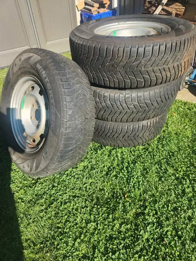Set of 4 winter tires and rims, almost new. Only used a couple times before I took truck off the roa...