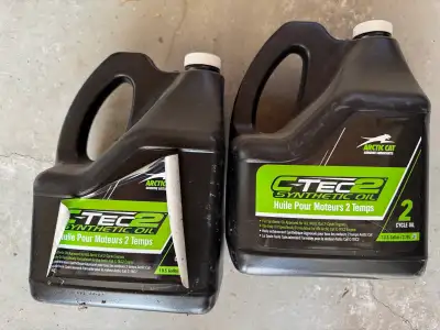 Arctic Cat full synthetic 2 stroke oil. One unopened jug, and one half full jug. These have just bee...