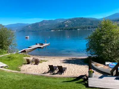 Modern Vintage, private beach and dock, 3/4's of an acre of lake front. Great beds, washer/dryer, fu...