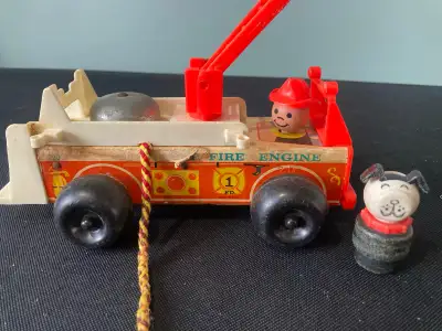 Vintage 1968 wood and plastic fire engine, Fisher-Price toy Comes with the dog. Missing one piece of...