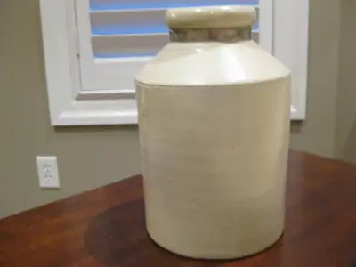 Antique 10" Stoneware Earthenware Crock with metal neck band. This lovely antique Crock is a straigh...