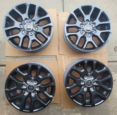 Set of four 20 inch original rims from a 2024 Toyota Tundra Platinum. Black finish. Original tires m...