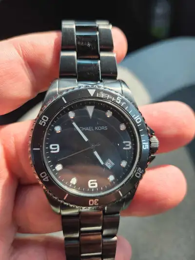 Selling my used Michael Kors watch, which is in fair condition as you can see by the photos. It feat...