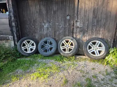 4 tires and Aluminum rims we had on a few Jeeps over the years. I think they came off a Dodge avenge...