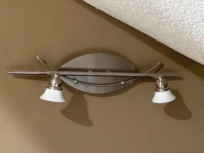 Like new 2-light wall mounted track light including two GU10 dimmable bulbs. Perfect for a above a b...