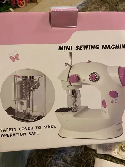 Mini sewing machine, View more