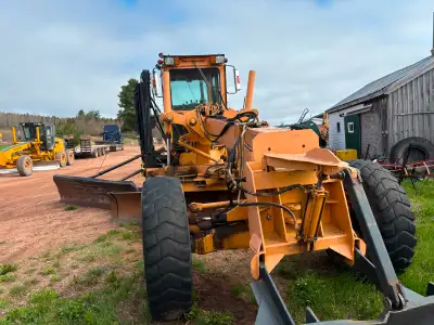 champion grader , detroit motor , comes with wing and v blade , chains , runs great , reason for sel...
