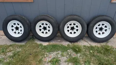Set of 4 used Goodyear Marathon 205/75 R15 Load C rated tires and rims in fair condition. Asking $20...