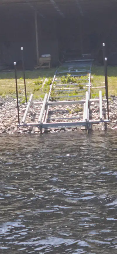 Protect your pontoon and skip the hassle of trailers and launch ramps. This Naylor marine railway le...