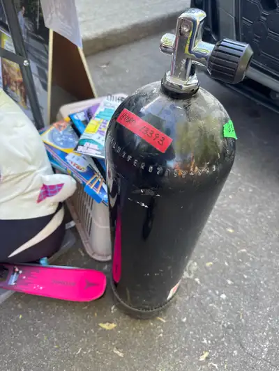 This Luxfer scuba tank is available for sale and is in used condition, showing signs of wear from pr...