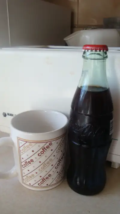 Coke bottle sealed and refrigerated for years. Has RED DEER AB embossed on the glass bottom. Has JA0...