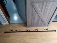 Hanging sliding door with railing