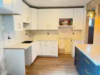 Maple wood kitchen cabinet with golden handles, quartz counterto
