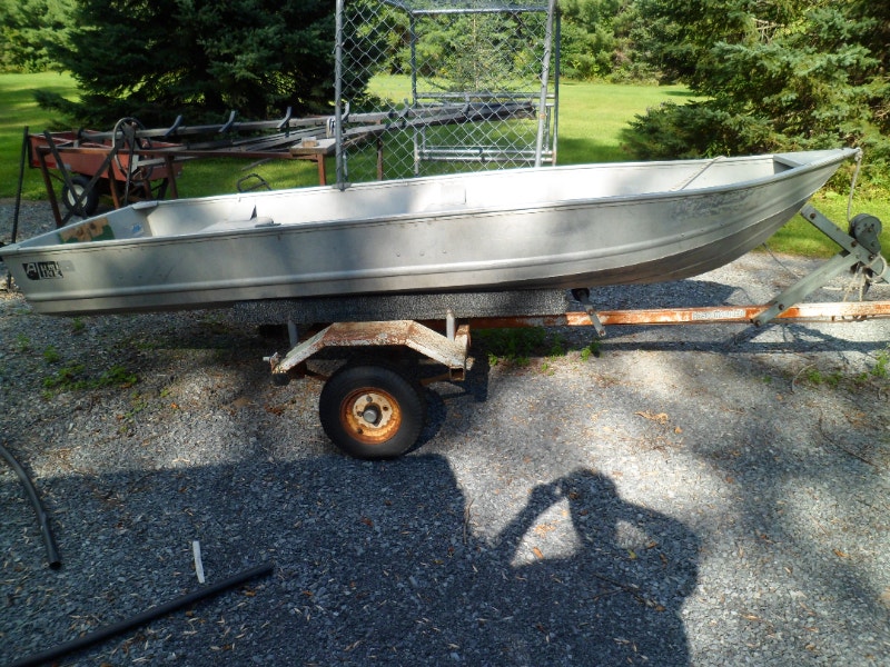 12 foot aluminum boat , on trailer, with 3 hp vintage Johnson