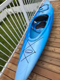  10 foot sitin kayak with spray kit and paddle  