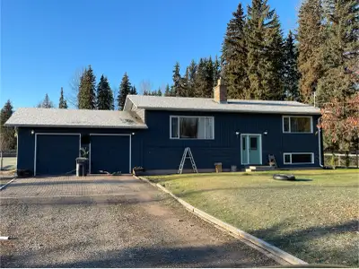 Home for sale in Telkwa on a large lot. 1.75 acres, 4 bedroom 2 bath split level home with a garage....